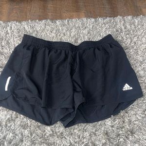 Size larger black Adidas shorts